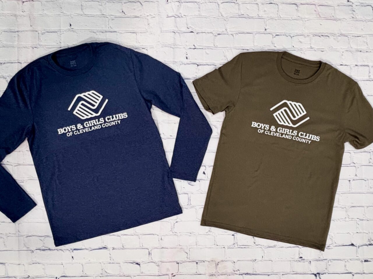 Screen printed Boys and Girls Club t-shirts in navy and olive