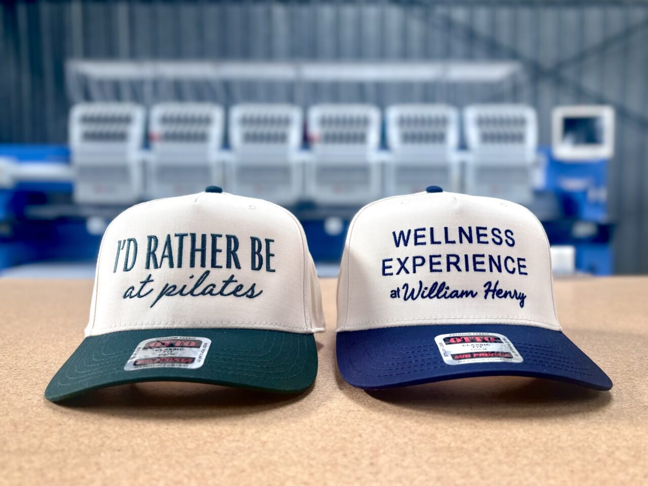 Embroidered custom hats on the press at Madcap