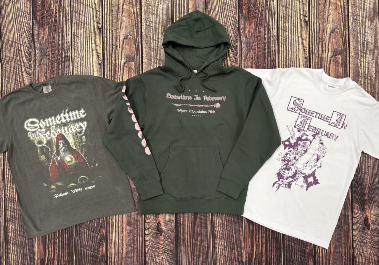 Custom printed hoodies and t-shirts on a wood background